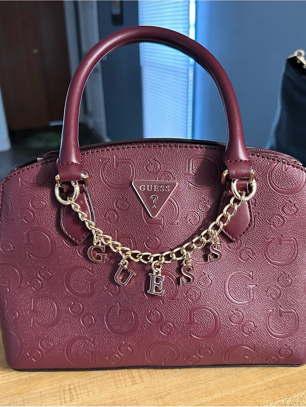 Guess Burgundy Embossed Logo Satchel with Gold Letter Charm Chain
